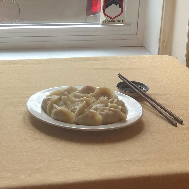 Straight off the steam, A full plate of hand-folded dumplings, the way Friday should look.