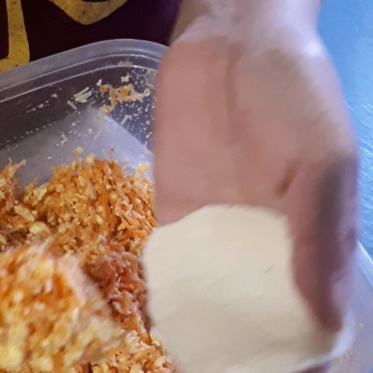 Folding the filling, Hands-deep in the prep. This is where each dumpling starts.