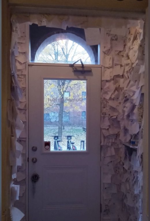 The front door, Look closely: every inch around the glass is covered in notes.